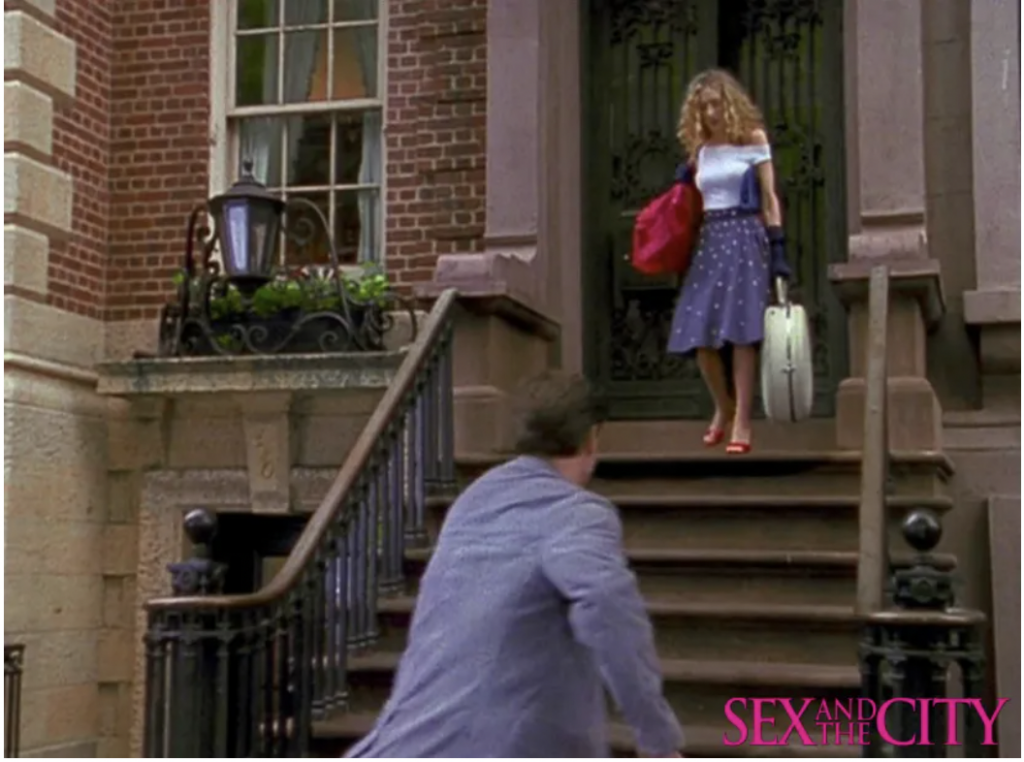 a scene from Sex and the City. Carrie climbing down a brownstone stoop. 